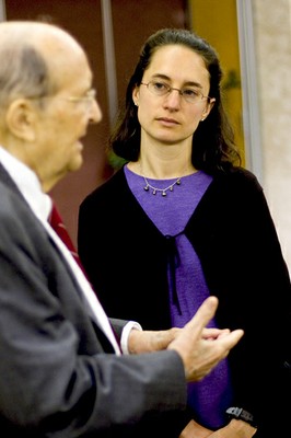 Julie Flapan watches Lou Harris talk