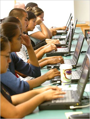Focused and pensive, seminar participants use their laptops to write reflective journals about their experiences as students and researchers in urban schools. Focused and pensive, seminar participants use their laptops to write reflective journals about their experiences as students and researchers in urban schools.