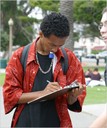 Students solicit information from high school students at the Santa Monica Pier.