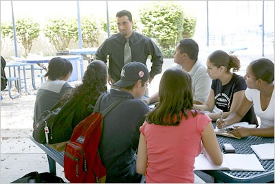 Students look on and take notes during an interview with a school official at South High School. Students look on and take notes during an interview with a school official at South High School.