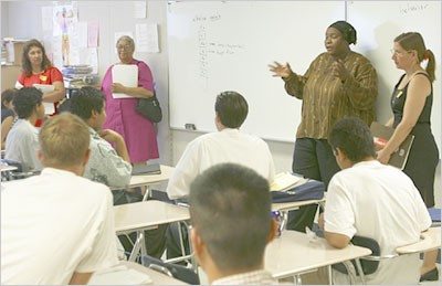 Mary Johnson and a contingent of parent researchers present to a class of Jordan High students. Mary Johnson and a contingent of parent researchers present to a class of Jordan High students.