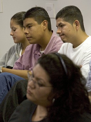 Youthful participants listen to Tom Hayden speak