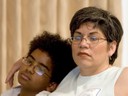 Christine Senteno watches the presentation with her son